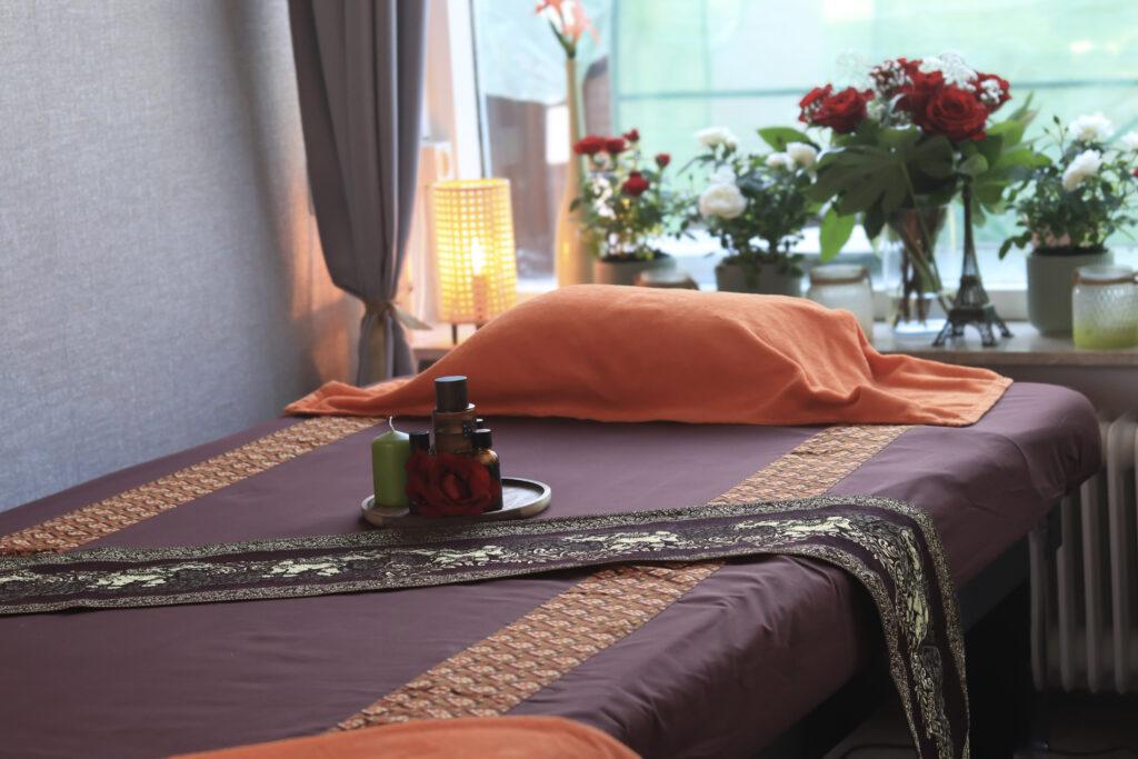Warm and cozy massage room with soft lighting and relaxing atmosphere